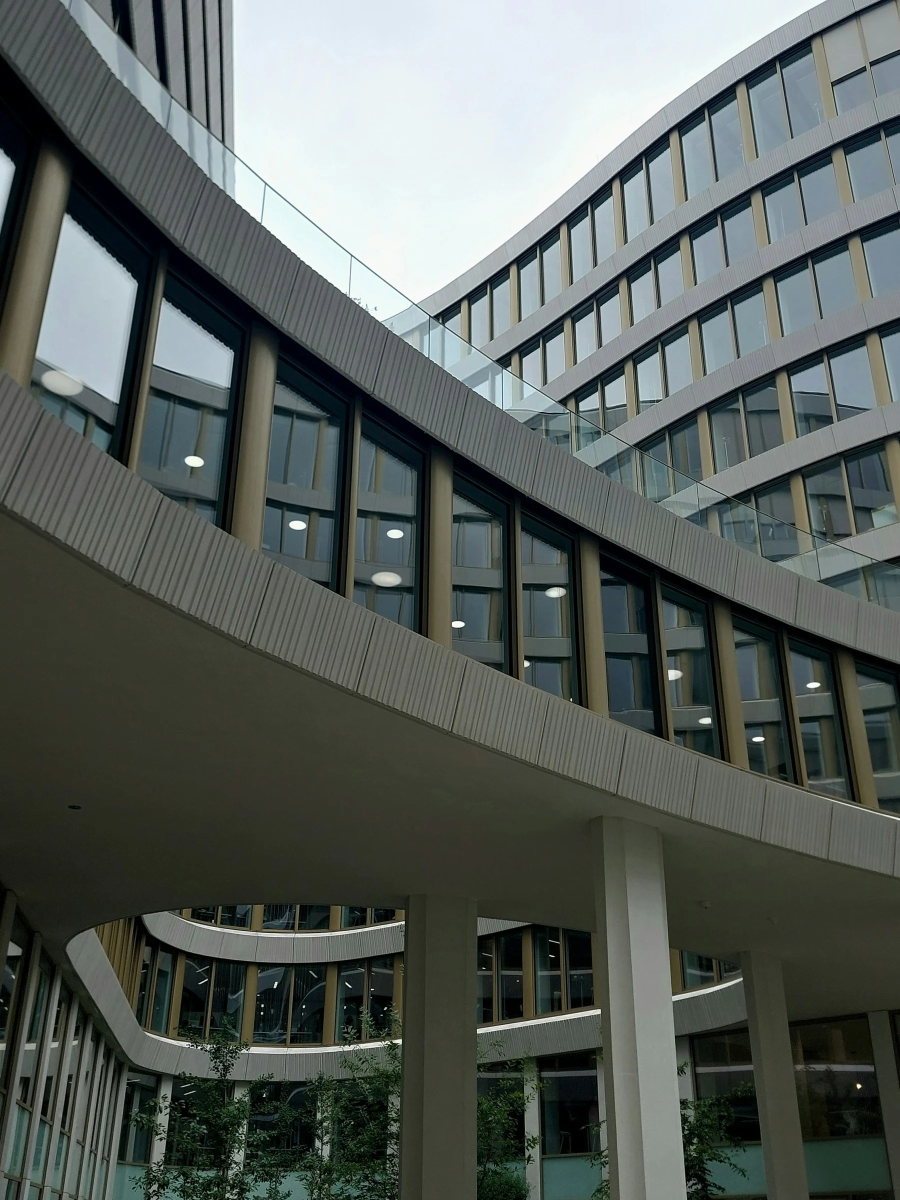 A contemporary institutional building and courtyard, used as editorial architecture imagery