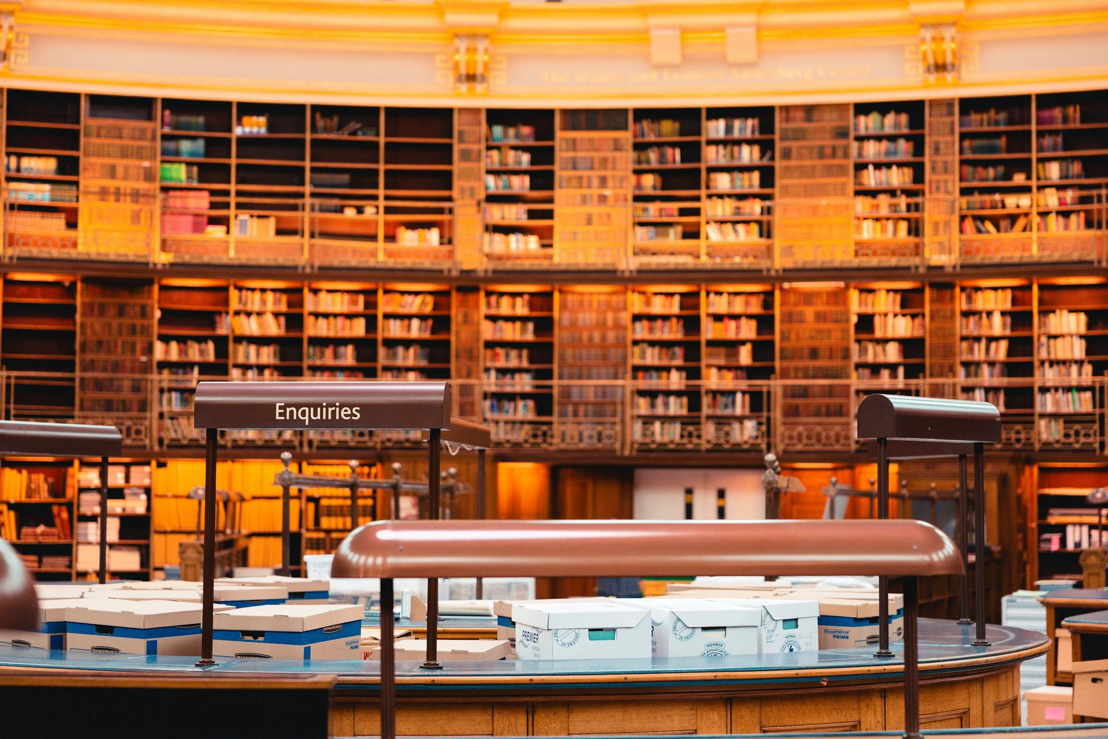 A working research library with reading tables and shelves of reference books